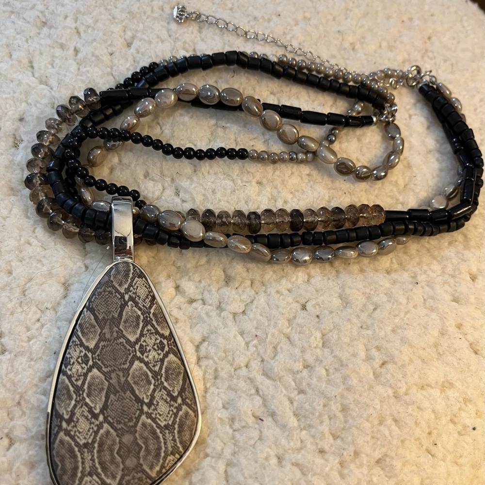 Multi-Strand Black and Gray Beaded Necklace with Snake-Print Teardrop Pendant